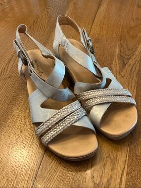 Woman’s BareTraps gold metallic wedge sandal. Size 10. Velcro top strap.Like new
